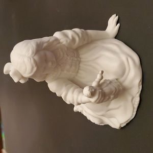 Girl with doll figurine